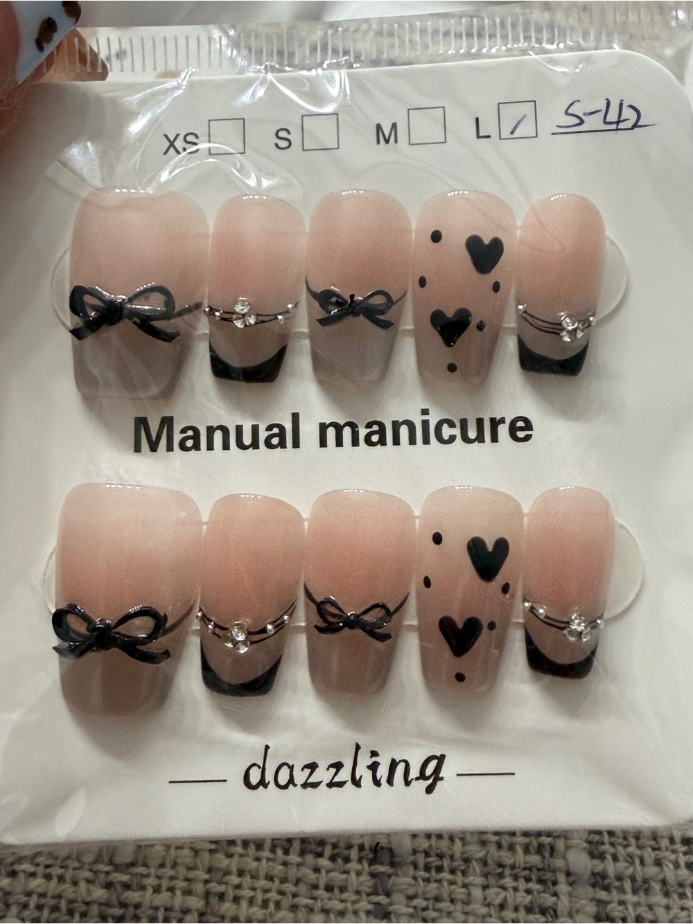 Dazzling Nude Pink Press-On Nails with Black Bow & Heart Accents